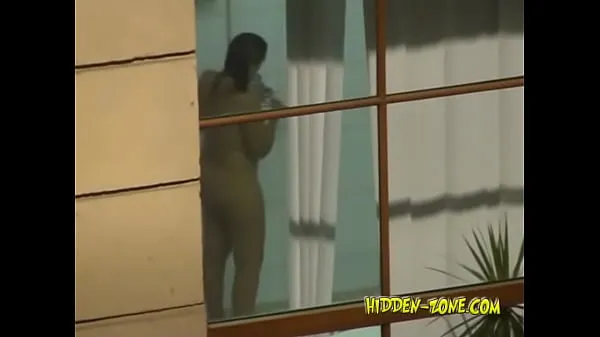 Hot A girl washes in the shower, and we see her through the window warm Movies
