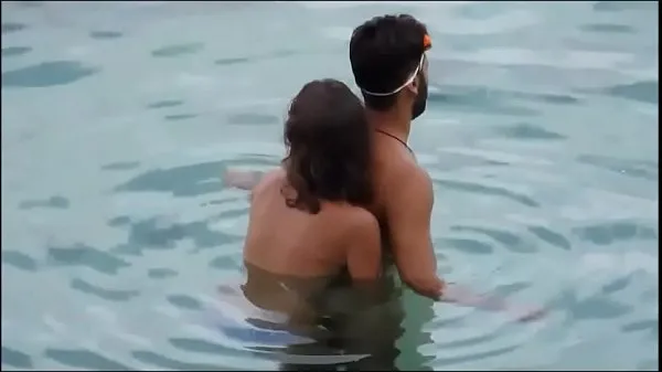 Girl gives her man a reacharound in the ocean at the beach - full video xrateduniversity. com Film hangat yang hangat
