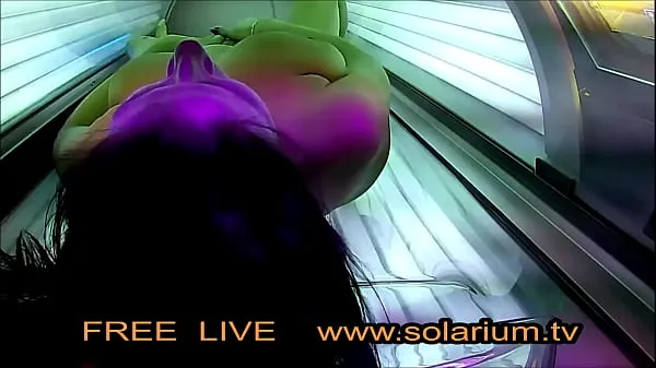 Hot Horny Girl with big breasts masturbates under the solarium warm Movies