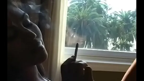 This slut shows her huge bust whilst holding a cigarette Film hangat yang hangat