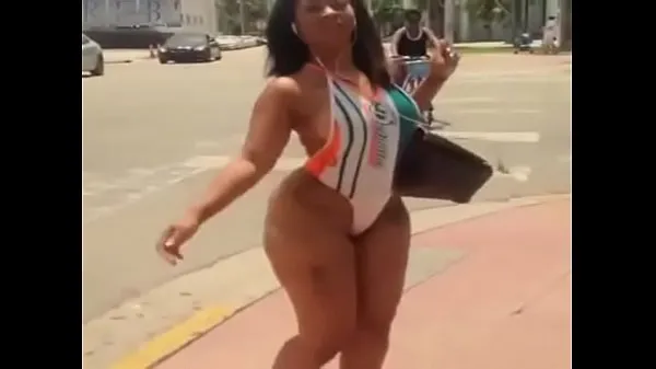 Hot sexy latina in swimsuit walking on the street warm Movies