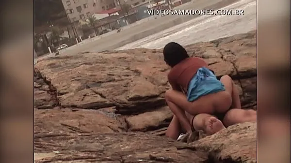 Hot Busted video shows man fucking mulatto girl on urbanized beach of Brazil warm Movies