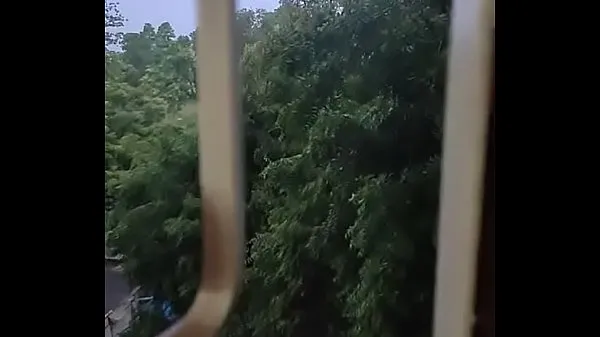Husband fucking wife in doggy style by enjoying the rain from window Filem hangat panas