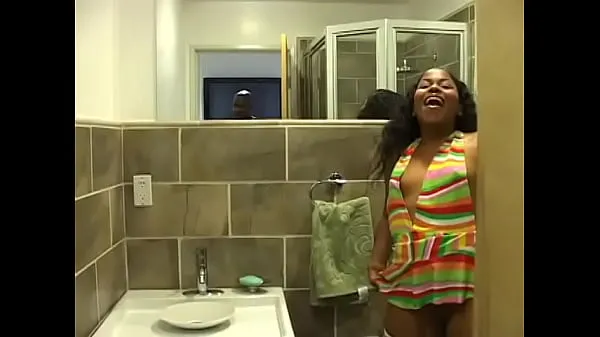 Hot Ebony chick in white fishnet stockings pissing in the toilet and filming warm Movies