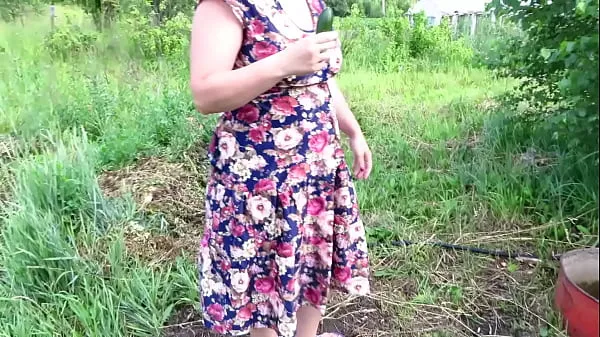 Hot Busty milf masturbates with cucumber and strawberries outdoors in a public place Juicy PAWG and big tits in nature Fetish warm Movies