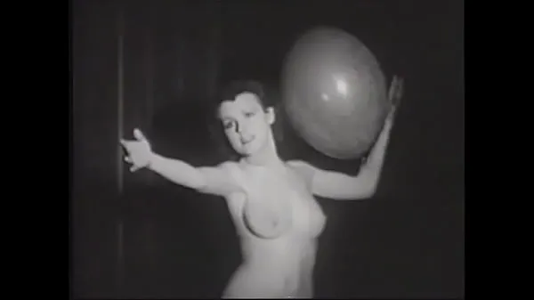 Hot Erotic retro model with a beautiful figure plays with balloons for the crowd on stage warm Movies