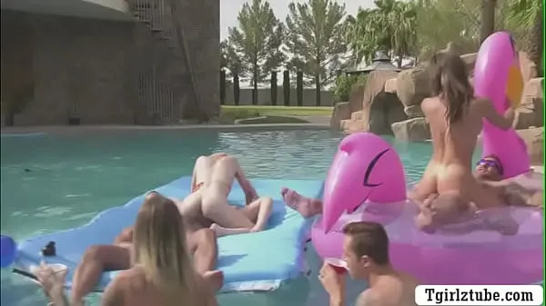 Busty shemales are in the swimming pool with many guys that,they decide to do orgy and they start kissing each is,they suck their big cocks passionately and they let them bareback their wet ass too Film hangat yang hangat