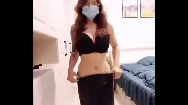 Young tattooed woman takes off her bra Filem hangat panas
