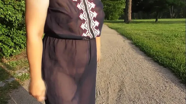 Hot Chubby woman in transparent dress in public park warm Movies