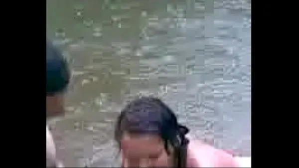 Young girl getting into the river Filem hangat panas